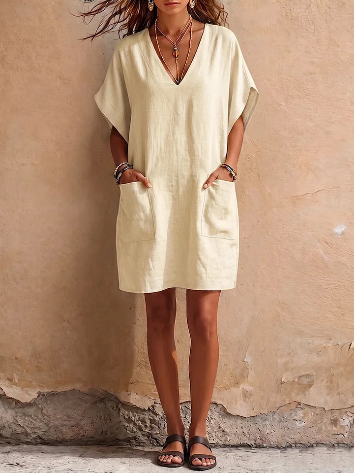 Vestido em algodão e linho com decote em V, simples e elegante.