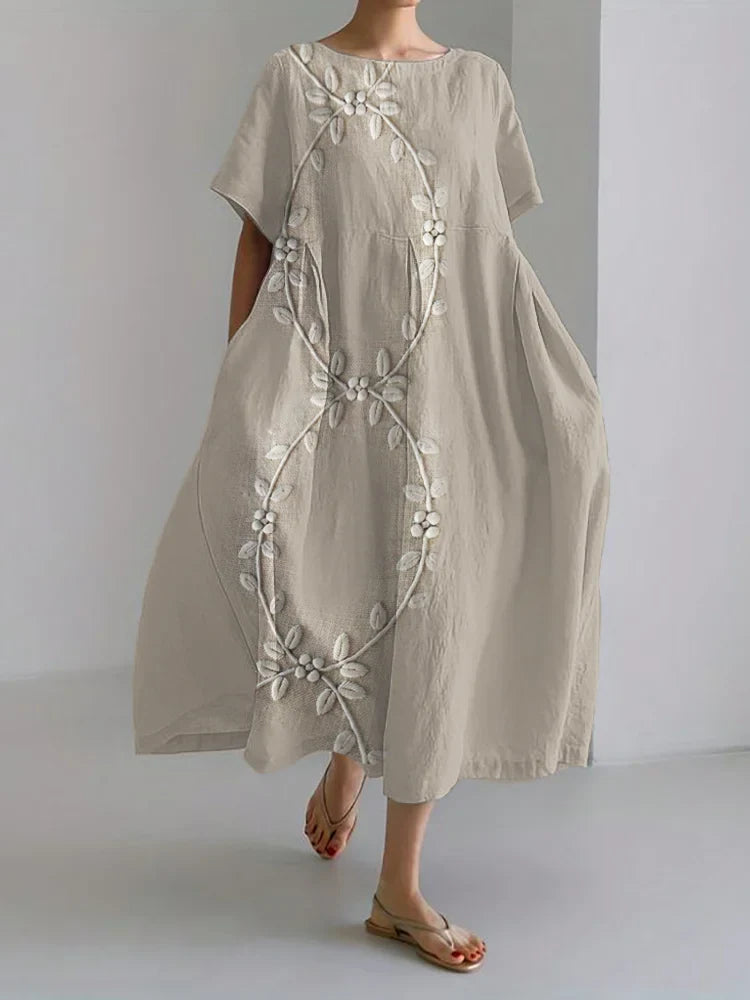 Elegante vestido comprido em mistura de linho e bordado com videiras