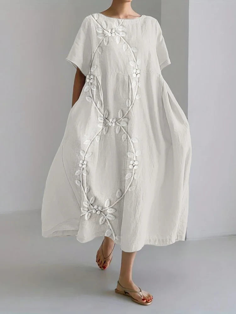 Elegante vestido comprido em mistura de linho e bordado com videiras