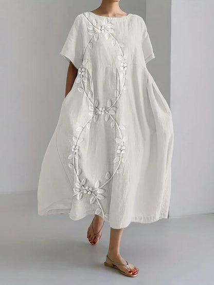 Elegante vestido comprido em mistura de linho e bordado com videiras