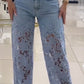 Calça de ganga feminina com patchwork e renda vazada