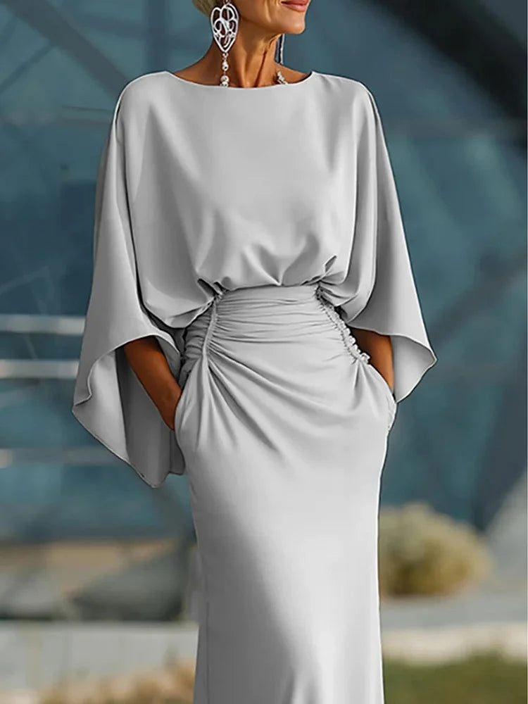 Vestido elegante com decote em V, costas nuas e mangas morcego