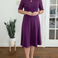Vestido midi liso com mangas 3/4 e decote redondo