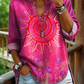 Camisa casual de mulher em algodão denim lavado com estampado floral de girassóis e decote em V.