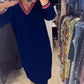 Vestido elegante com decote em V e bolsos