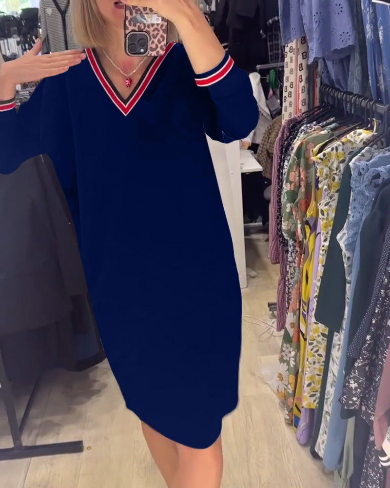 Vestido elegante com decote em V e bolsos