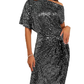 Um vestido de lantejoulas que atrai todos os olhares com as suas curvas irresistíveis e confiança inigualável