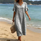 Vestido de mulher em algodão com decote em V, corte largo e borlas.