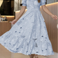 Vestido elegante com bordado floral vazado