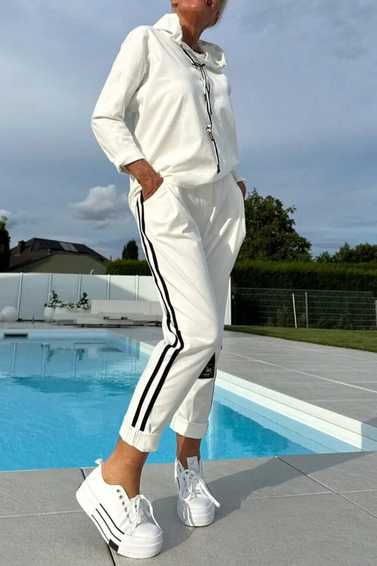 Blusa de mulher de gola redonda com cordão + calças listradas verticais e fato casual 2025