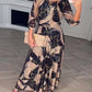 Vestido elegante em chiffon com estampado e mangas a três quartos
