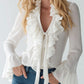 Blusa de menina com folhos e mangas sino