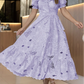 Vestido elegante com bordado floral vazado