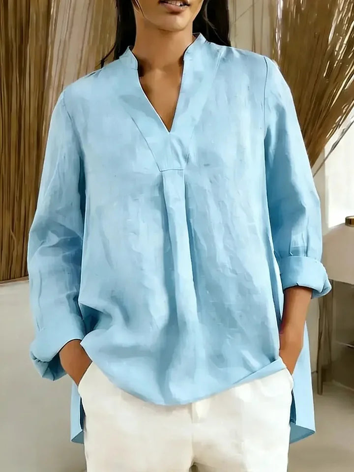 Blusa de mulher em algodão de manga comprida, cor lisa, decote em V e corte largo