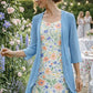Elegante conjunto de duas peças para mulher, composto por um vestido de chiffon e um casaco de malha.