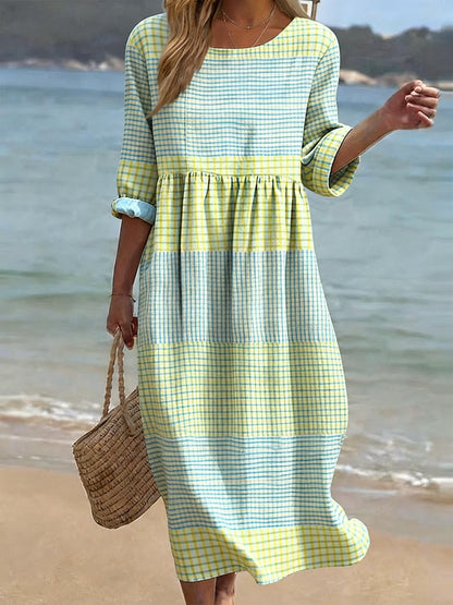 Vestido casual de mulher em algodão e linho com estampado, gola redonda e mangas médias.