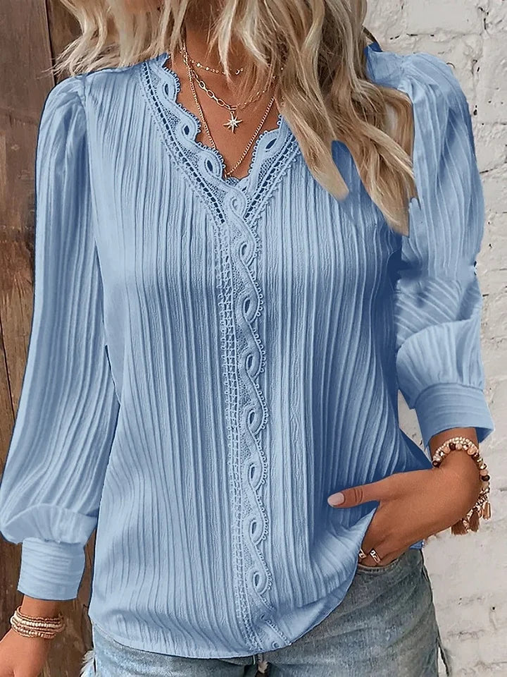 Camisa de senhora em renda, elegante e moderna, de cor sólida
