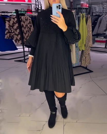 Vestido com mangas balão e gola alta