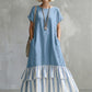 Vestido comprido largo e aconchegante em algodão e linho com estampado de patchwork às riscas e folhos.