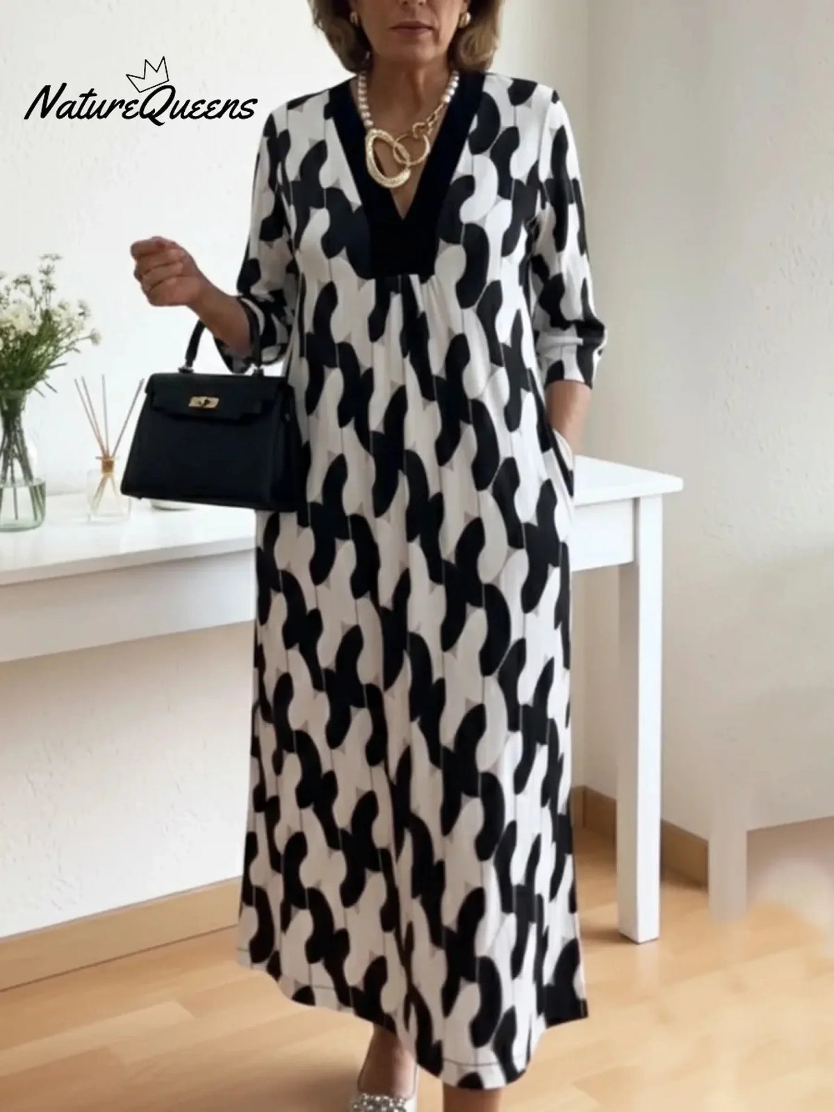 Um elegante vestido midi adornado com estampados artísticos e decote em V