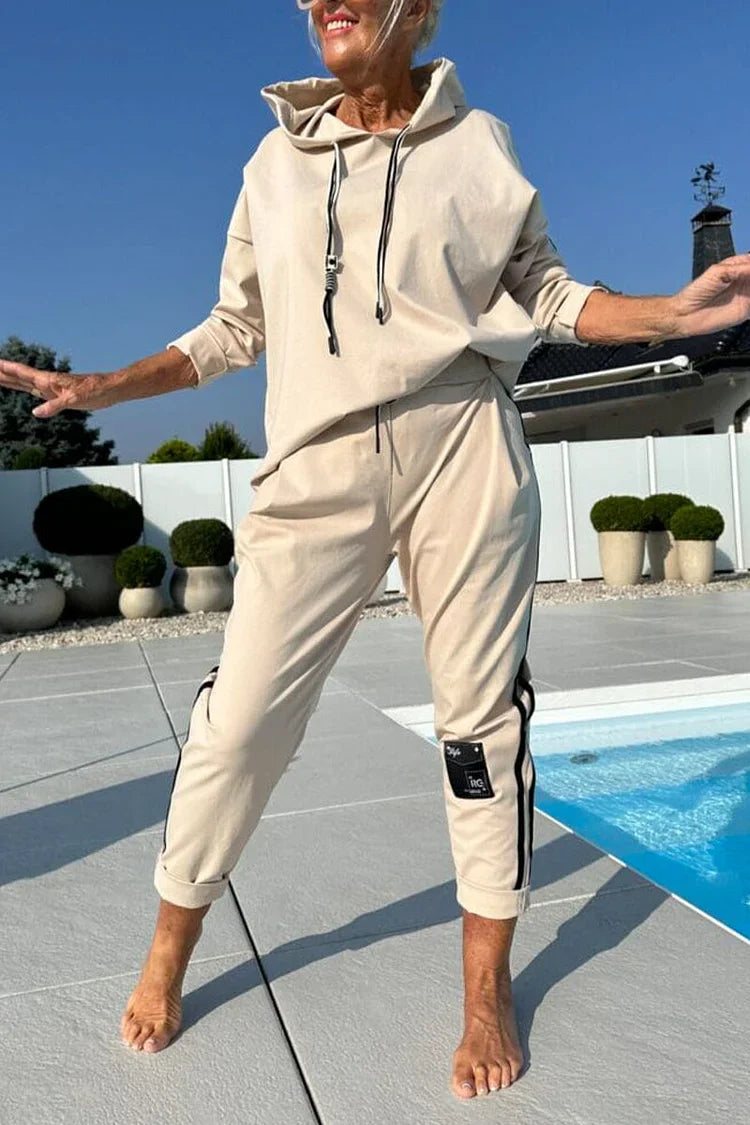 Blusa de mulher de gola redonda com cordão + calças listradas verticais e fato casual 2025