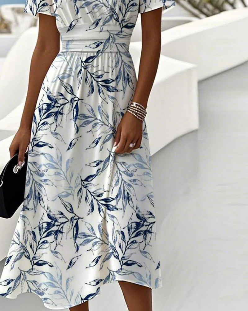 Vestido elegante com estampado botânico