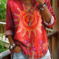 Camisa casual de mulher em algodão denim lavado com estampado floral de girassóis e decote em V.