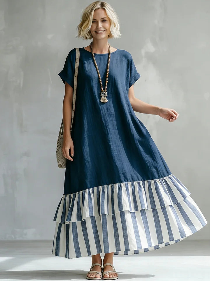 Vestido comprido largo e aconchegante em algodão e linho com estampado de patchwork às riscas e folhos.