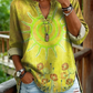 Camisa casual de mulher em algodão denim lavado com estampado floral de girassóis e decote em V.