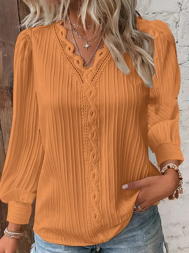 Camisa de senhora em renda, elegante e moderna, de cor sólida