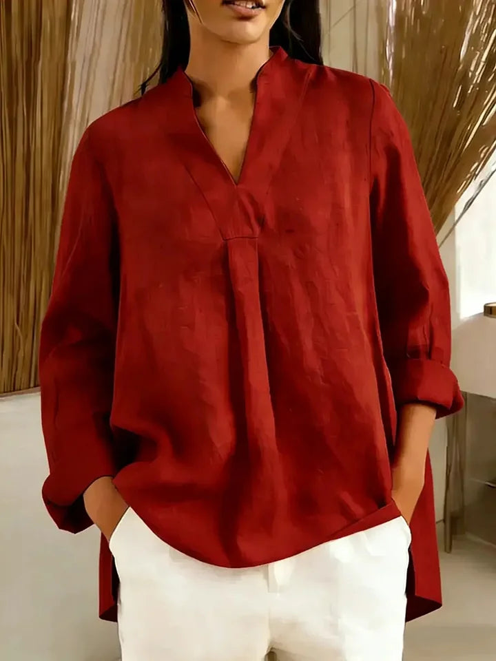 Blusa de mulher em algodão de manga comprida, cor lisa, decote em V e corte largo