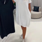 Vestido de manga curta com gola redonda e corte largo