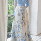 Elegante vestido comprido com estampado floral, decote em V e mangas compridas
