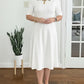 Vestido midi liso com mangas 3/4 e decote redondo