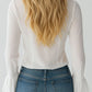 Blusa de menina com folhos e mangas sino