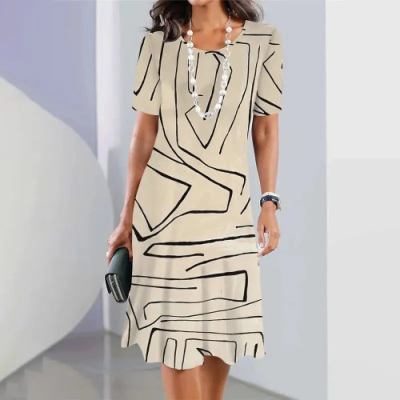 Novo vestido elegante com estampado em contraste e decote redondo.