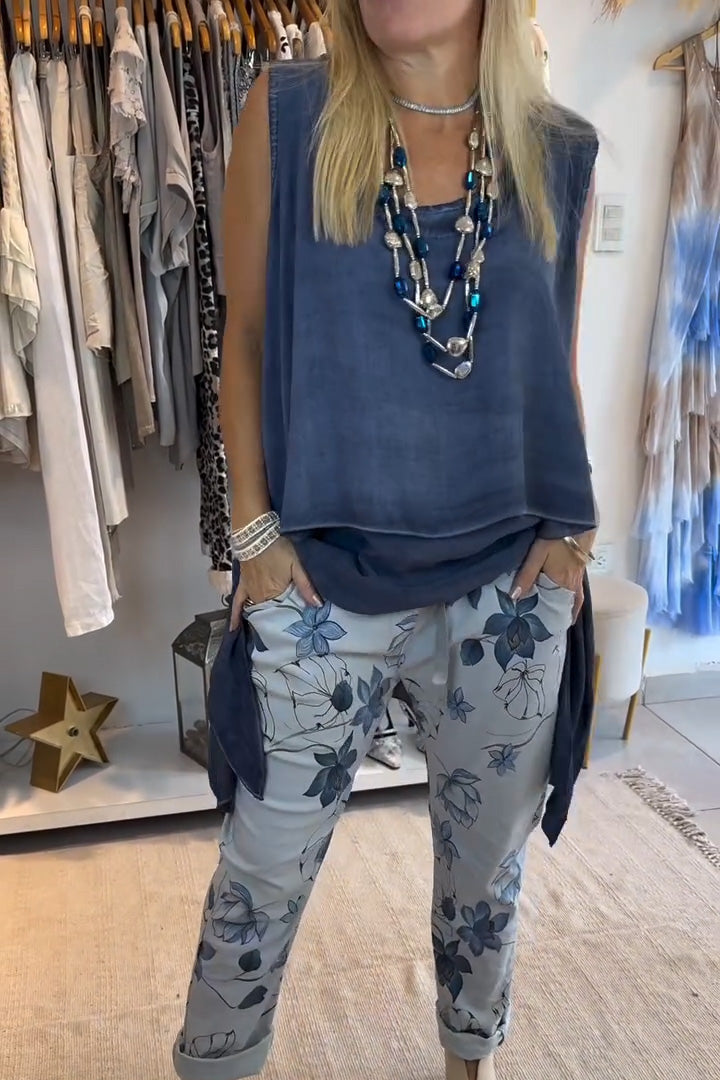 Blusa casual de mulher de cor sólida, sem mangas, bainha irregular
