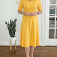 Vestido midi liso com mangas 3/4 e decote redondo