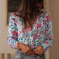 Camisa de manga comprida com botões e estampado floral rosa e detalhes em renda