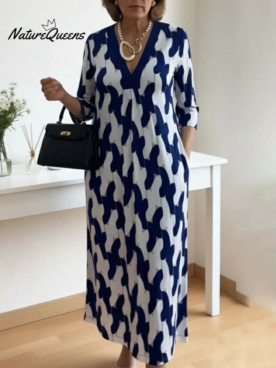 Um elegante vestido midi adornado com estampados artísticos e decote em V