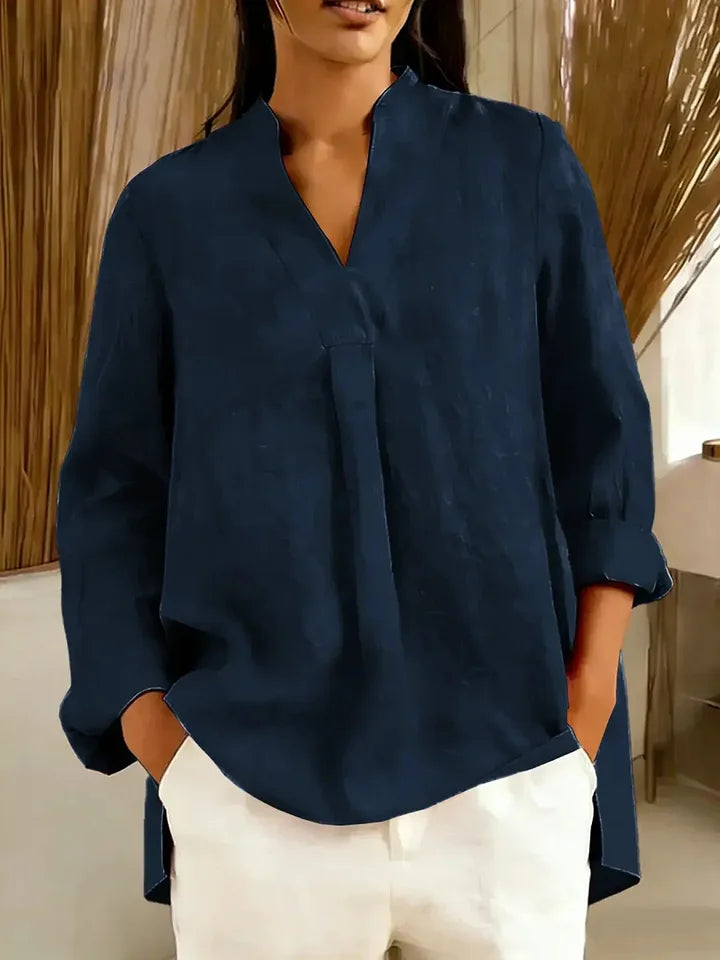 Blusa de mulher em algodão de manga comprida, cor lisa, decote em V e corte largo