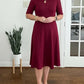 Vestido midi liso com mangas 3/4 e decote redondo