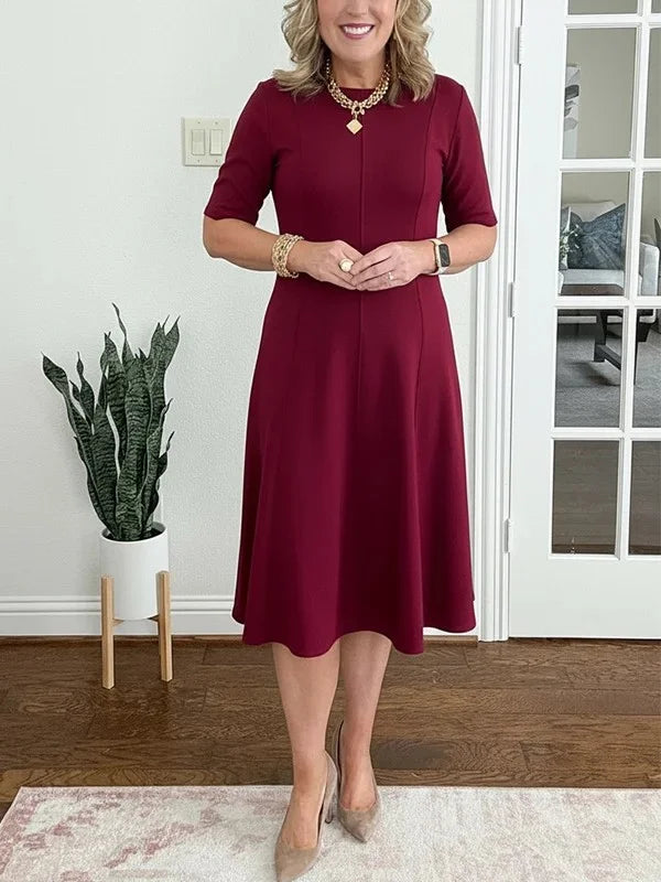 Vestido midi liso com mangas 3/4 e decote redondo