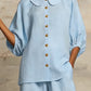 Elegante conjunto de linho de duas peças, composto por camisa e calças de pernas largas