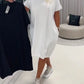 Vestido de manga curta com gola redonda e corte largo