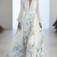 Elegante vestido comprido com estampado floral, decote em V e mangas compridas