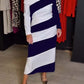 Vestido feminino elegante e às riscas com ombros largos