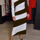 Vestido feminino elegante e às riscas com ombros largos