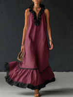Vestido comprido elegante e romântico com folhos e blocos de cor